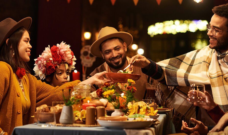 Happy family celebrating the holiday together at dining table outdoors
